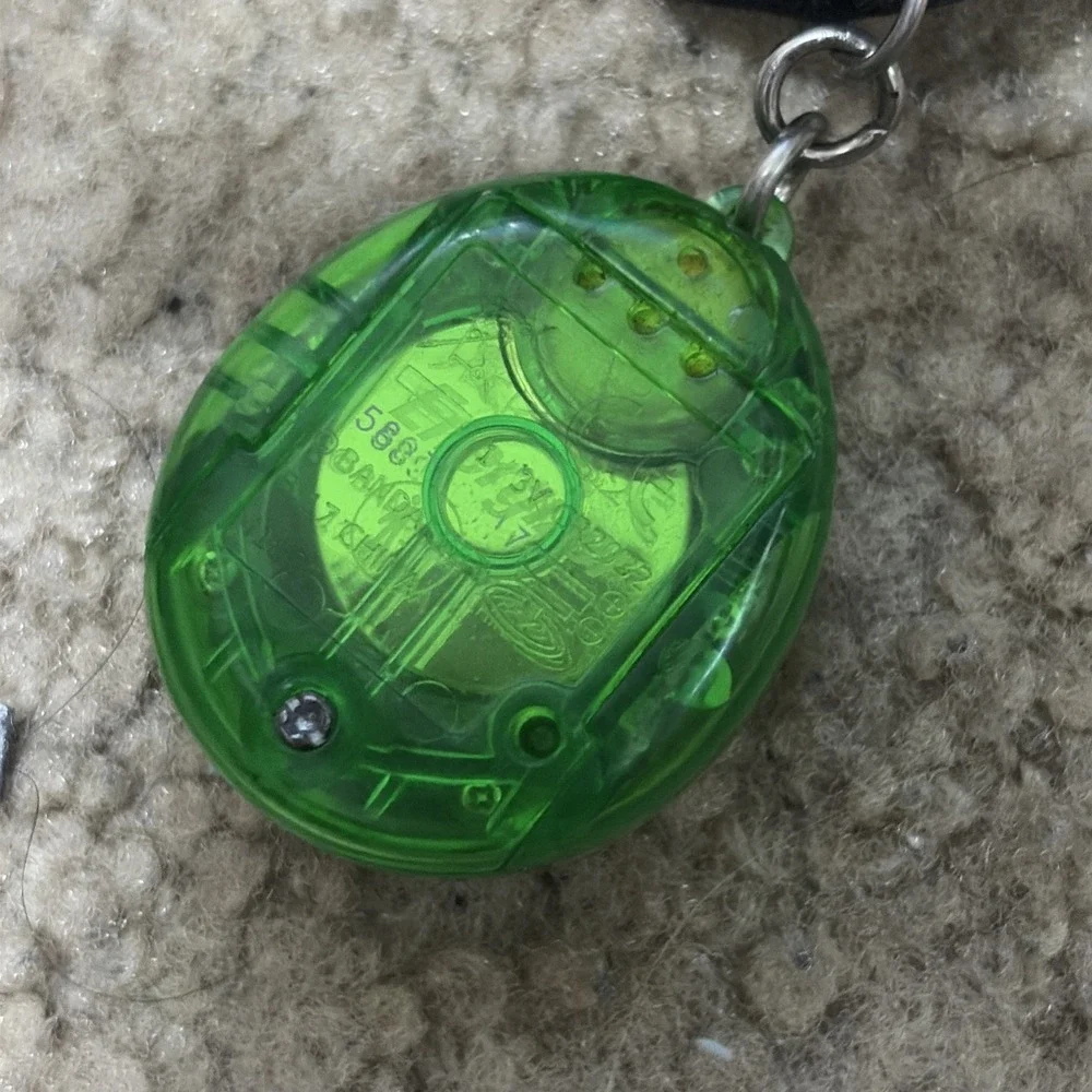 Bandai Tamagotchi Clear Green  Working And Purple Needs Battery